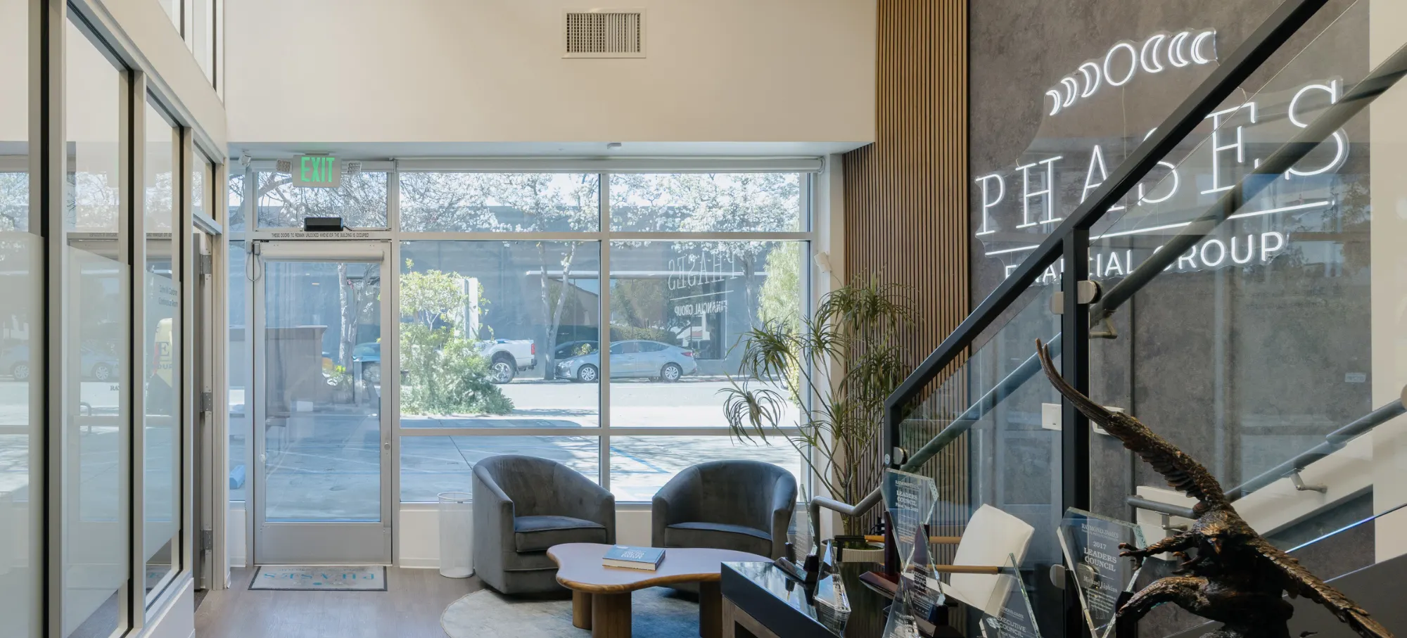 The lobby of Phases Financial Group's Palo Alto office, featuring the firm's illuminated sign.