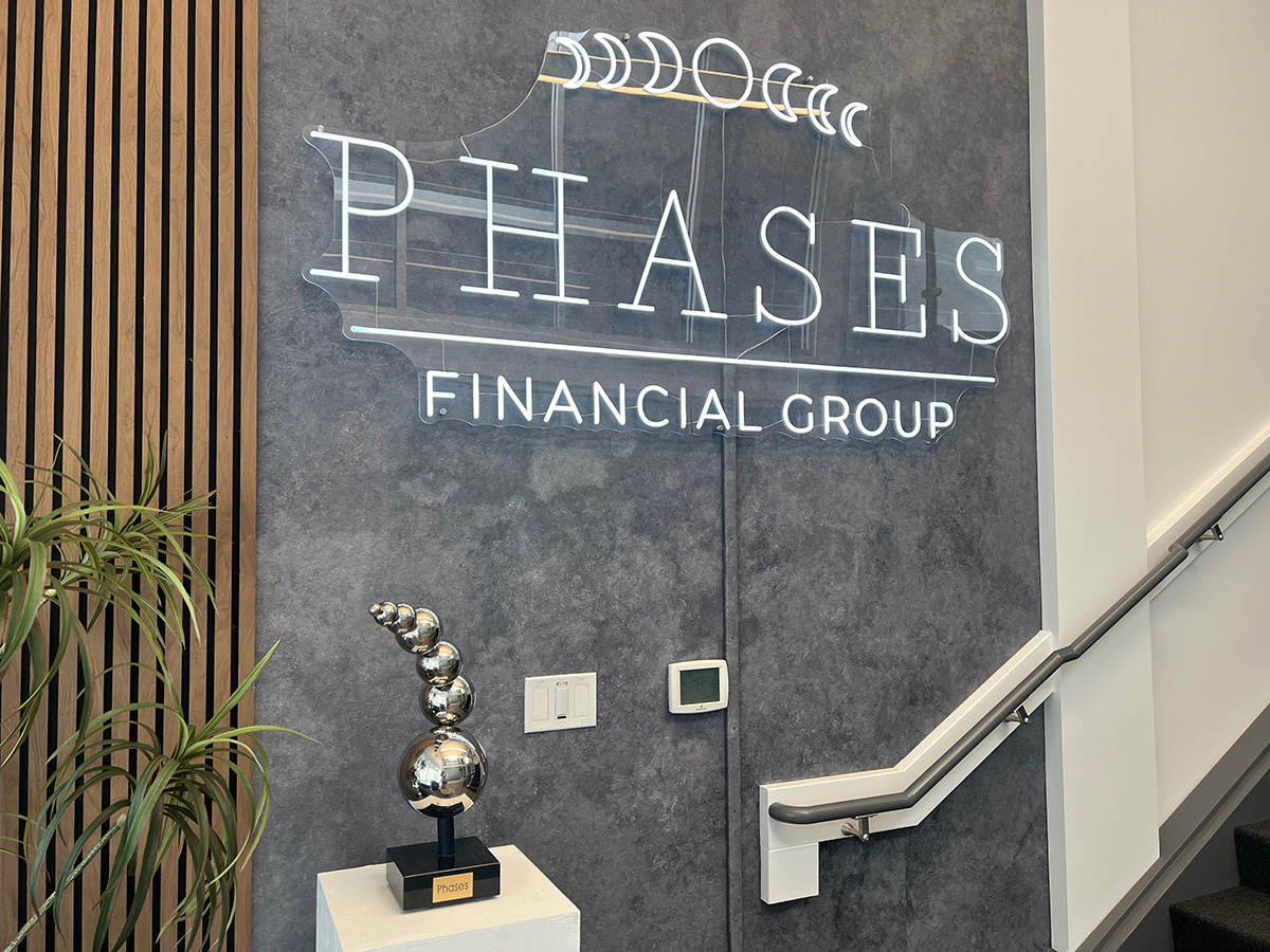 An image of the Phases sign in the lobby of Phases Financial Group's Palo Alto, CA offices