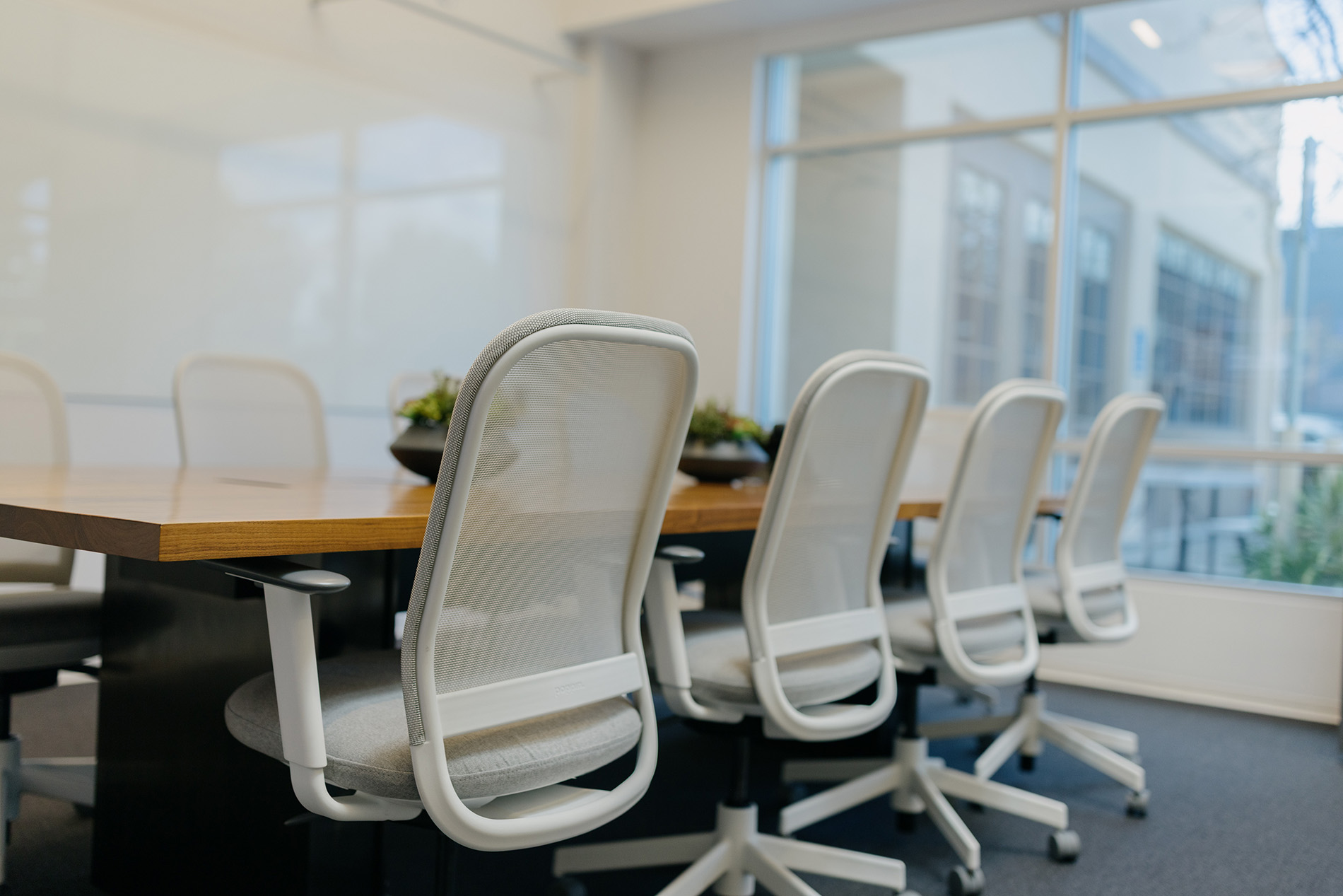 An empty conference room table and chairs in Phases Financial Group's Palo Alto, CA office, where the firm's Financial Advisors meet with clients.